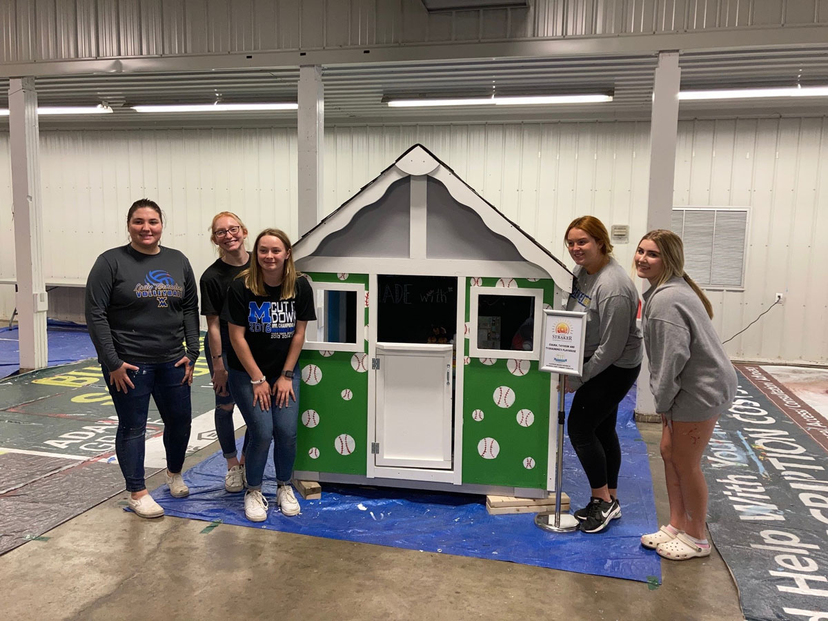 Finished House – CYF Members Gabby Ihlenfeld, Liberty Best, Eliza Carter, Annika Lindsey, and Alivia Sims stand in front of their finished playhouse